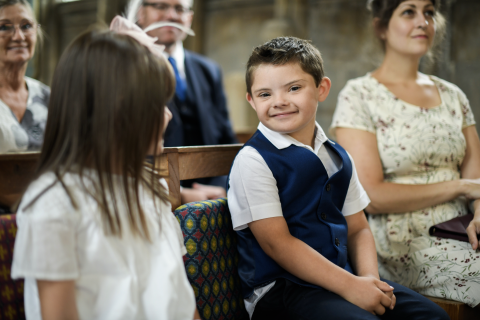young boy with down syndrome at church