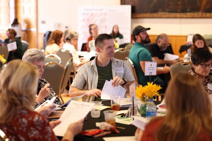 Photo of cohort members collaborating in a breakout activity.