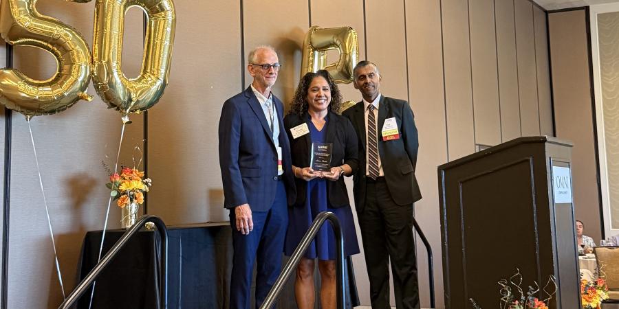 Dr. Kristen Padilla receiving award