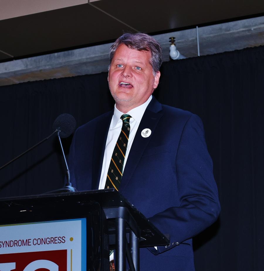 Photo of Erik Carter speaking at National Down Syndrome Congress Big Game Ball